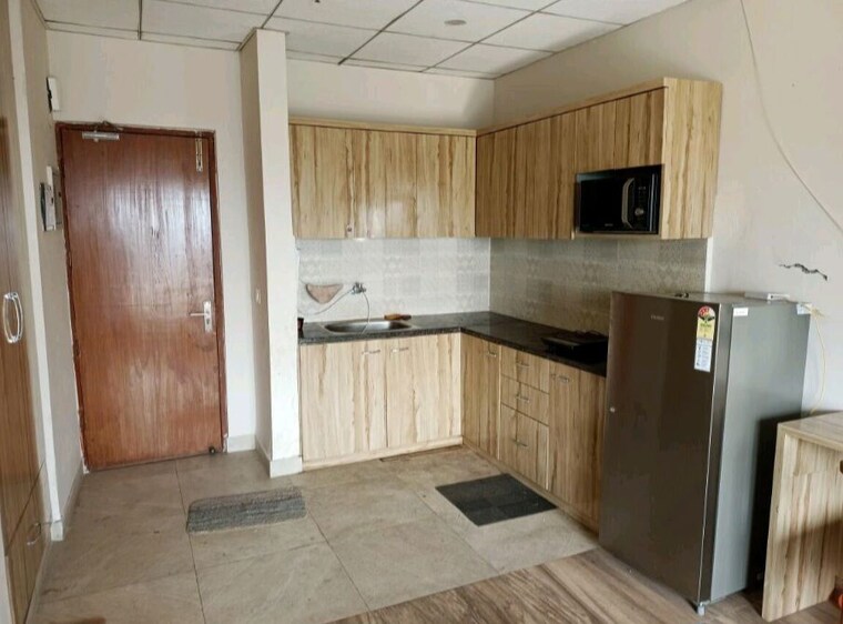 Kitchen, paramount-golf-foreste-apartments 1 Bedroom 880 Sq.Ft. Apartment In Zeta I Greater Noida Greater Noida 10436962