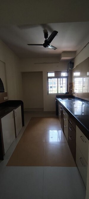 Kitchen in 2 BHK Apartment at Cosmos Harmony, Majiwada – for Rent