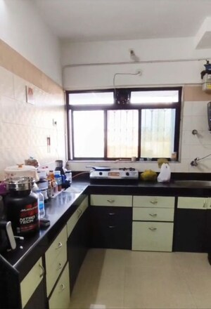 Kitchen in 2 BHK Apartment at Cosmos Heritage, Manpada – for Rent