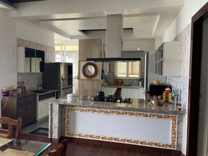 Kitchen in 4 BHK Penthouse at Aman Luxury Apartments, Sahastradhara Road – for Sale