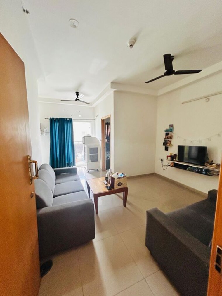 Living Room, mantri-celestia 2 Bedroom 850 Sq.Ft. Apartment In Gachibowli Hyderabad 10437805