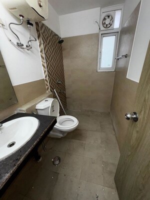 Bathroom in 3 BHK Apartment at ATS Happy Trails, Sector 10 Greater Noida – for Rent