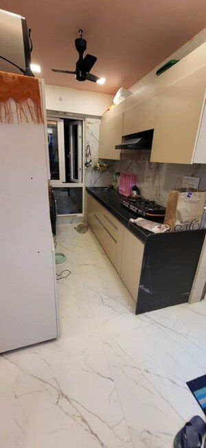 Kitchen in 1.5 BHK Apartment at Deraiya Iconico, Kurla East – for Sale