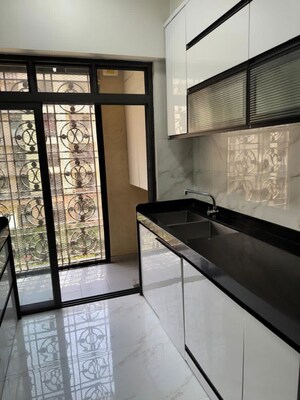 Kitchen in 2 BHK Apartment at Rosa Gardenia, Ghodbunder Road – for Rent