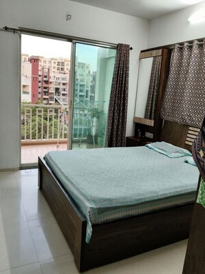 Bedroom in 2 BHK Apartment at Shreyas Palladium Grand, Dhanori – for Rent
