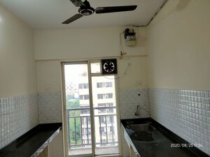Kitchen in 1 BHK Apartment at Rosa Royale, Ghodbunder Road – for Rent
