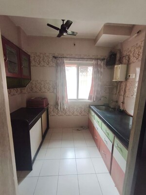 Kitchen in 1 BHK Apartment at Raunak Delight, Owale – for Rent