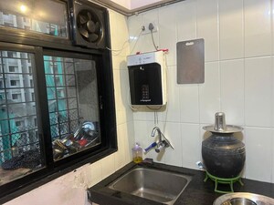 Living Room in 1 BHK Apartment at Raunak Unnathi Woods Phase 4 And 5, Ghodbunder Road – for Rent