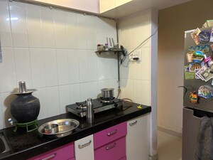Kitchen in 1 BHK Apartment at Raunak Unnathi Woods Phase 4 And 5, Ghodbunder Road – for Rent