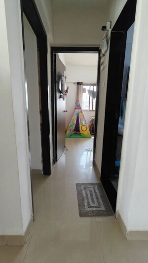 Building Lobby in 2 BHK Apartment at Runwal Garden City, Balkum Pada – for Rent
