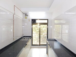 Kitchen in 3 BHK Apartment at Je And Vee Om Trimurti, Malad East – for Sale