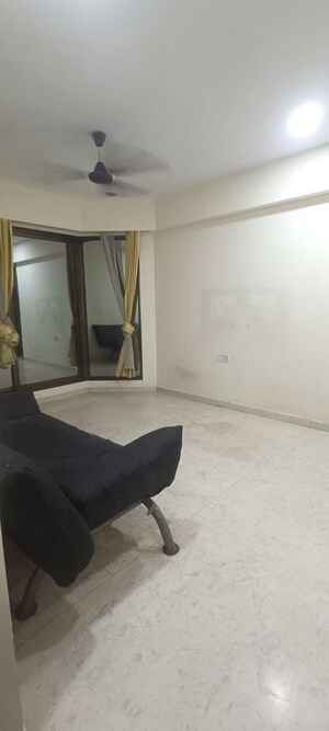 Living Room in 1 BHK Apartment at Baba Solitaire, Vashi Sector 26 – for Sale