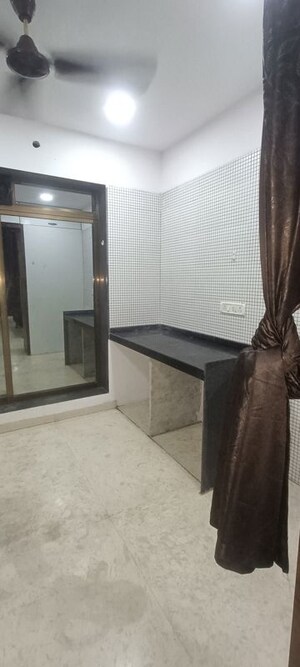 Kitchen in 1 BHK Apartment at Baba Solitaire, Vashi Sector 26 – for Sale