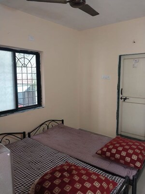 Bedroom in 2 BHK Apartment at Atharv Anand Apartments, Dhanori – for Rent