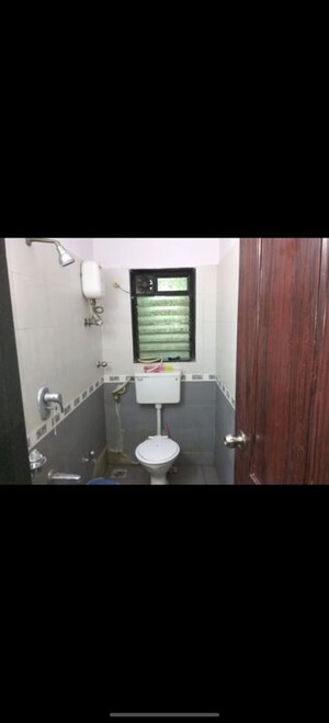 Bathroom in 2 BHK Apartment at Andheri CHS, Andheri West – for Rent