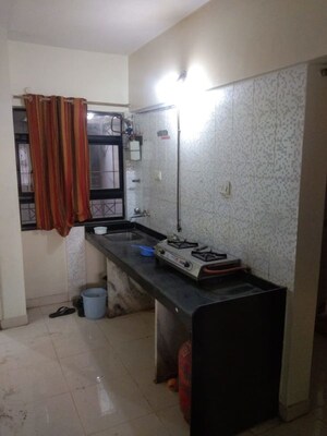 Kitchen in 2 BHK Apartment at Popular Colony Apartment, Warje – for Sale