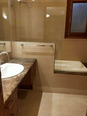 Bathroom in 4 BHK Apartment at Vasant Vihar – for Rent