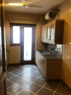 Kitchen in 4 BHK Apartment at Vasant Vihar – for Rent