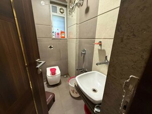 Bathroom in 2 BHK Apartment at Siddhachal Apartment 8, Vasant Vihar – for Rent