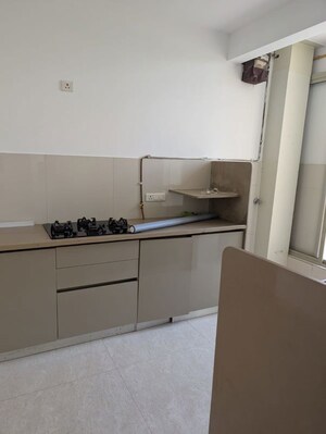 Kitchen in 2 BHK Apartment at Hiranandani Skylark Enclave, Ghodbunder Road – for Sale