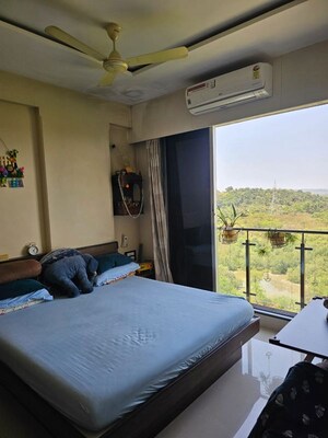 Bedroom in 2 BHK Apartment at C Teja Kaavya Beachwood CHS, Kandivali West – for Sale