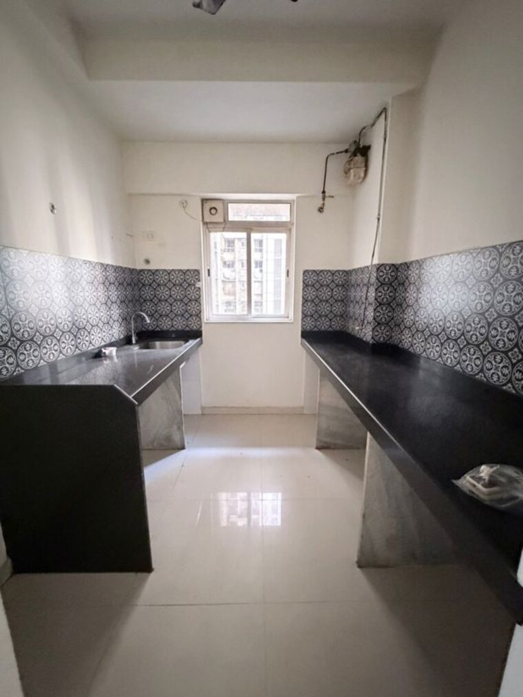 Kitchen, lodha-amara 1.5 Bedroom 551 Sq.Ft. Apartment In Kolshet Road Thane 10443535