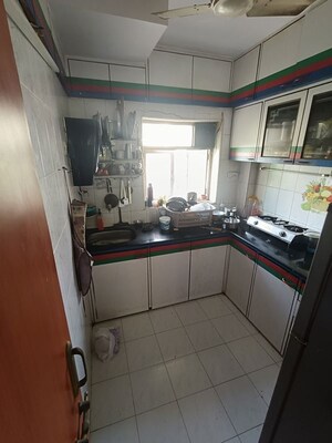 Kitchen in 2 BHK Apartment at Shree Amit Nagar CHS, Andheri West – for Rent