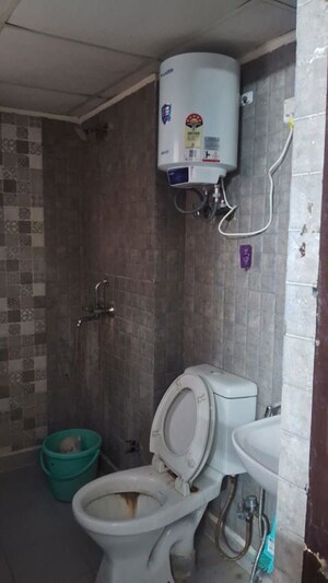 Bathroom in 2.5 BHK Apartment at Aims Golf City, Sector 75 – for Rent