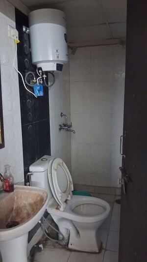 Bathroom in 2.5 BHK Apartment at Aims Golf City, Sector 75 – for Rent