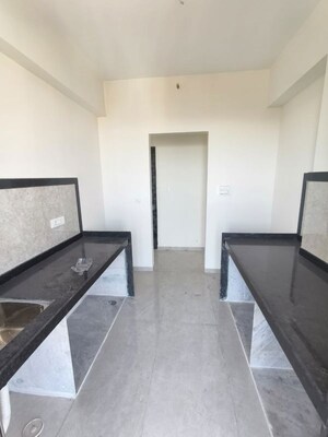 Kitchen in 2 BHK Apartment at Dhamji Shamji Mahavir Spring Tulip Phase 1, Pokhran Road No Two – for Sale