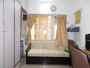 Living Room in 2 BHK Apartment at Amesh CHS, Tilak Nagar – for Sale