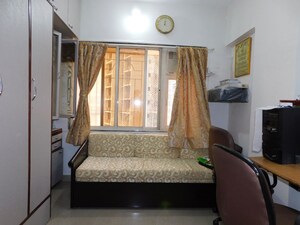Living Room in 2 BHK Apartment at Amesh CHS, Tilak Nagar – for Sale