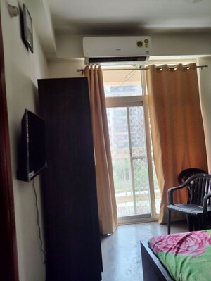 Living Room in 2 BHK Apartment at Mahagun My Woods, Sector 16c Greater Noida – for Rent