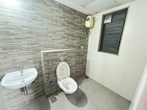 Bathroom in 1.5 BHK Apartment at Lodha Lakeshore Greens, Dombivli East – for Rent