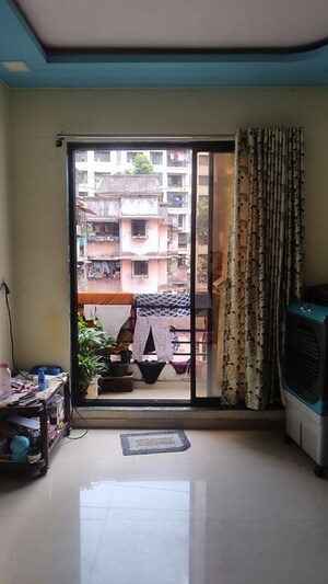 Living Room in 1 BHK Apartment at Ajanta Krupa CHS, Dombivli West – for Sale