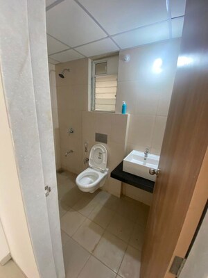 Bathroom in 1 BHK Apartment at Raunak Unnathi Woods, Ghodbunder Road – for Rent