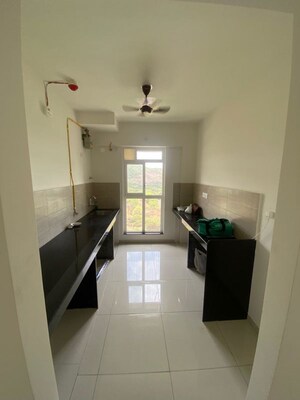 Kitchen in 1 BHK Apartment at Raunak Unnathi Woods, Ghodbunder Road – for Rent