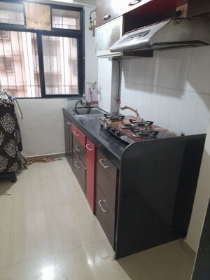 Kitchen in 1 BHK Apartment at Raunak Unnathi Woods, Ghodbunder Road – for Rent
