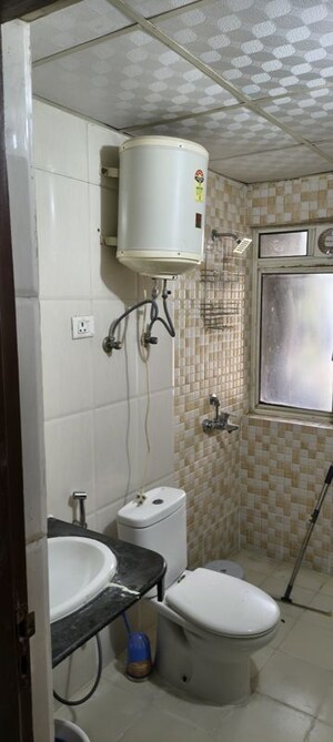 Bathroom in 2.5 BHK Apartment at Nimbus The Golden Palm, Sector 168 – for Rent