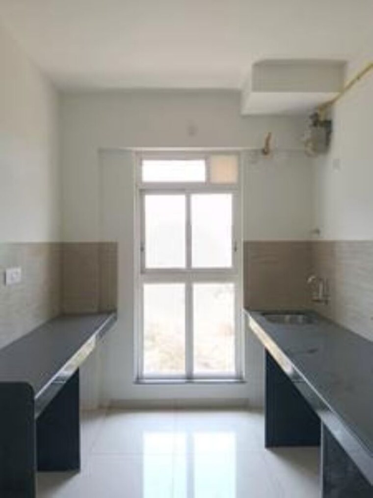 Kitchen, raymond-ten-x-habitat 2 Bedroom 605 Sq.Ft. Apartment In Pokhran Road No Two Thane 10446546