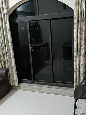Living Room in 2 BHK Apartment at Crystal Palace CHS, Malad West – for Rent