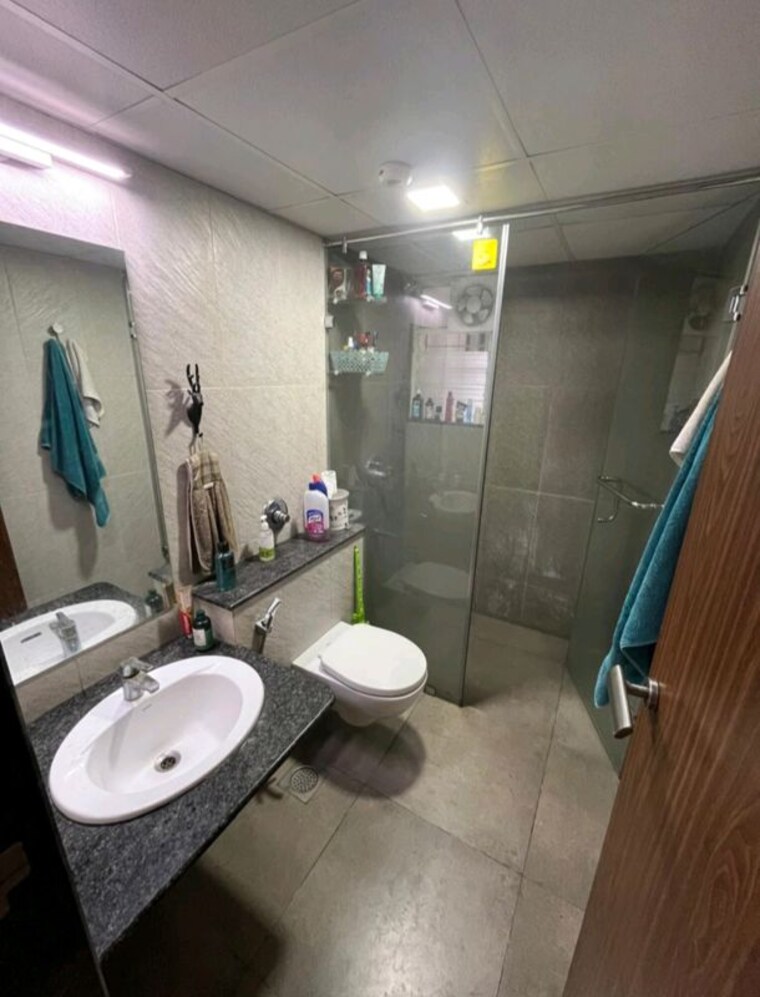 Bathroom, gera-song-of-joy 2 Bedroom 1000 Sq.Ft. Apartment In Kharadi Pune 10447389