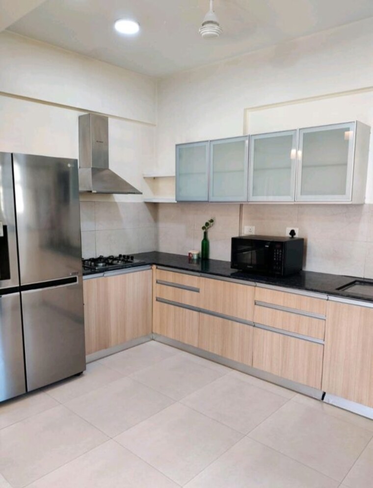 Kitchen, gera-song-of-joy 2 Bedroom 1000 Sq.Ft. Apartment In Kharadi Pune 10447389