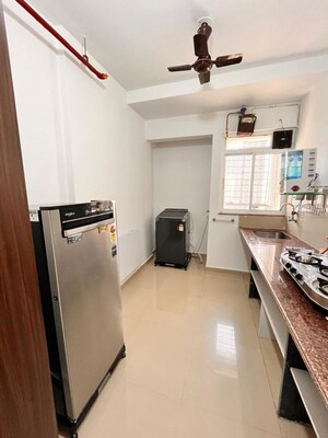Kitchen in 2 BHK Apartment at Puranik Hometown, Ghodbunder Road – for Rent