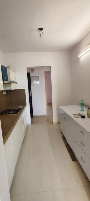 Kitchen in 2.5 BHK Apartment at Puranik Rumah Bali, Ghodbunder Road – for Rent