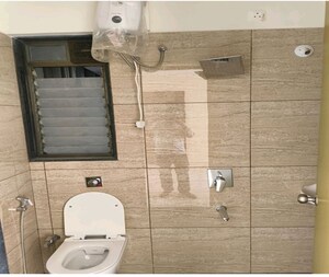 Bathroom in 2 BHK Apartment at Dynamix Shagun Mall Tower, Malad East – for Rent