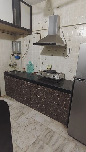Kitchen in 1 BHK Apartment at Salasar Cosmos CHS, Mira Road – for Sale