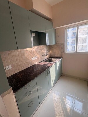 Kitchen in 1 BHK Apartment at Amrapali Dream Valley – for Rent