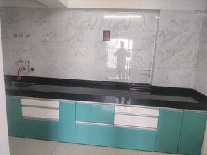 Kitchen in 2 BHK Apartment at Wadgaon Sheri – for Rent