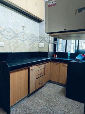 Kitchen in 2 BHK Apartment at Satya Jivan CHS, Lbs Marg – for Rent